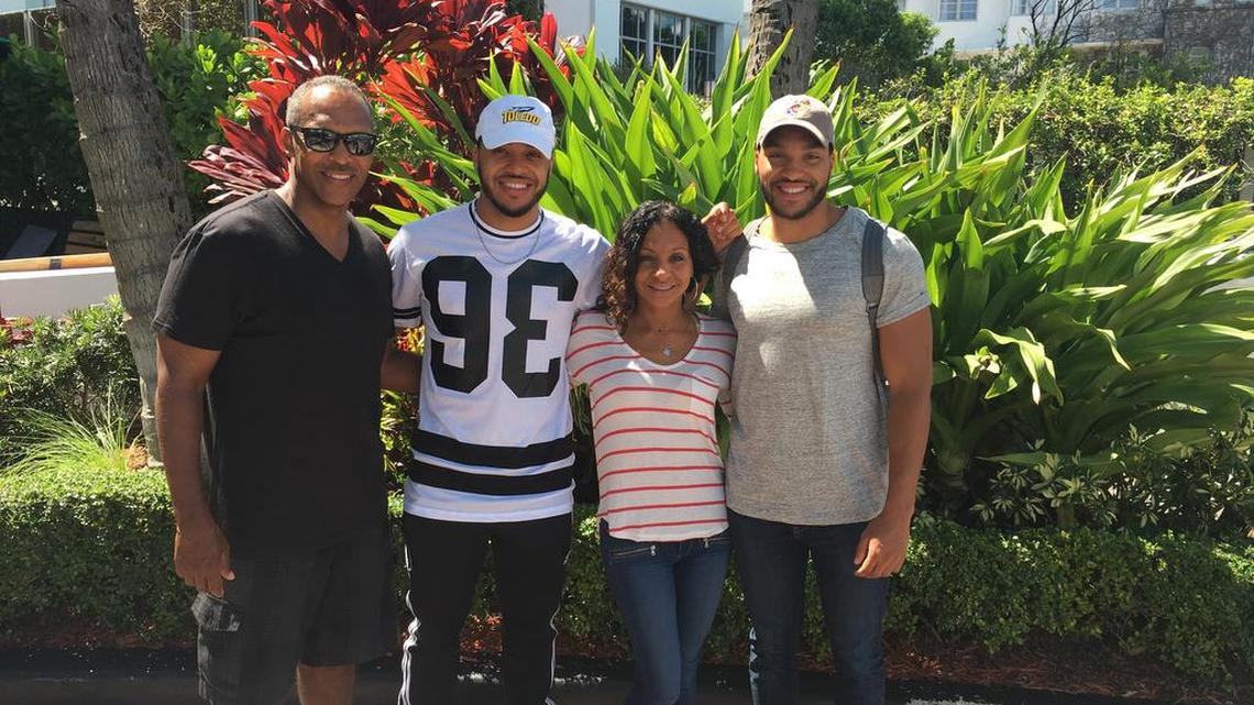 Former KU guard Niko Roberts (far right) is new associate commissioner of the Mountain West Conference. He is pictured here with his brother and former Toledo player Justin Roberts (second from left) and his parents: KU assistant Norm Roberts and Pascale Roberts.