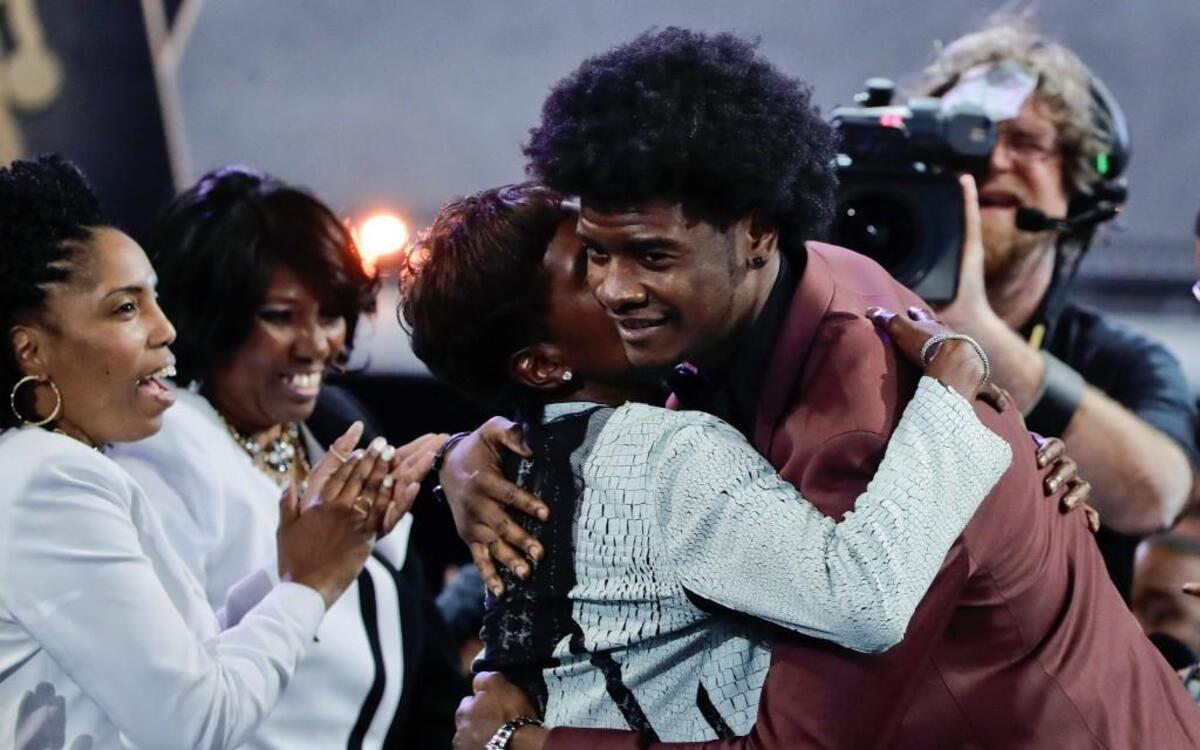 Josh Jackson (right) hugged friends and relatives after being selected by the Phoenix Suns fourth overall in Thursday’s NBA Draft in Brooklyn, N.Y.