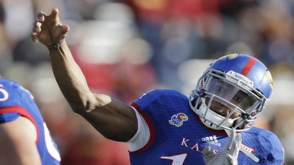 
Senior Kansas quarterback Michael Cummings finished last season as the starter and began the spring working with the first-string offense. But the coach says the competition for the fall starting position is ongoing. 


