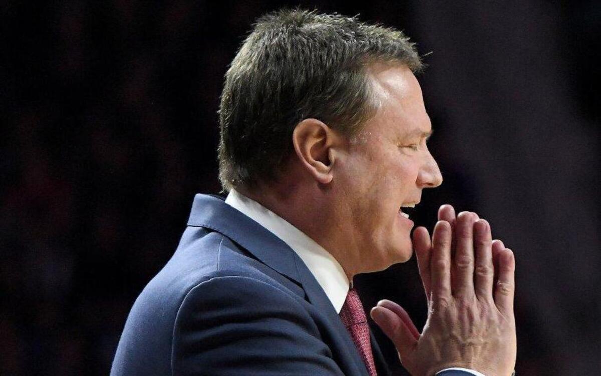 KU coach Bill Self (above) watched his team beat K-State 74-71 on Monday night, then went to Norman, Okla., to watch guard prospect Trae Young on Tuesday night.