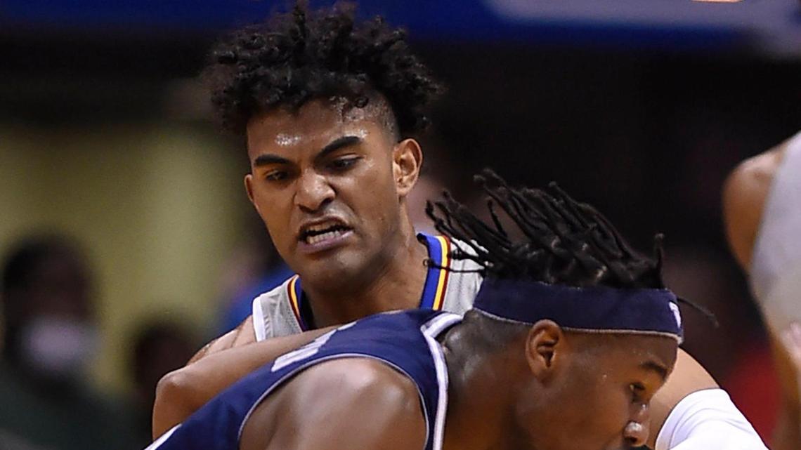 KU’s Remy Martin, rear, put the heat on Nevada’s Kenan Blackshear as he tried to drive to the basket during the first half of Wednesday night’s game at Allen Fieldhouse. KU beat Nevada, 88-61.