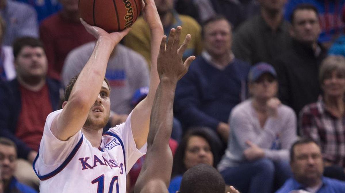 Kansas Jayhawks guard Sviatoslav Mykhailiuk (10) connected on a three-pointer as Tennessee State Tigers guard Daniel Cummings (22) defended at Allen Fieldhouse on Friday, November 10, 2017, in Lawrence, Kansas.
