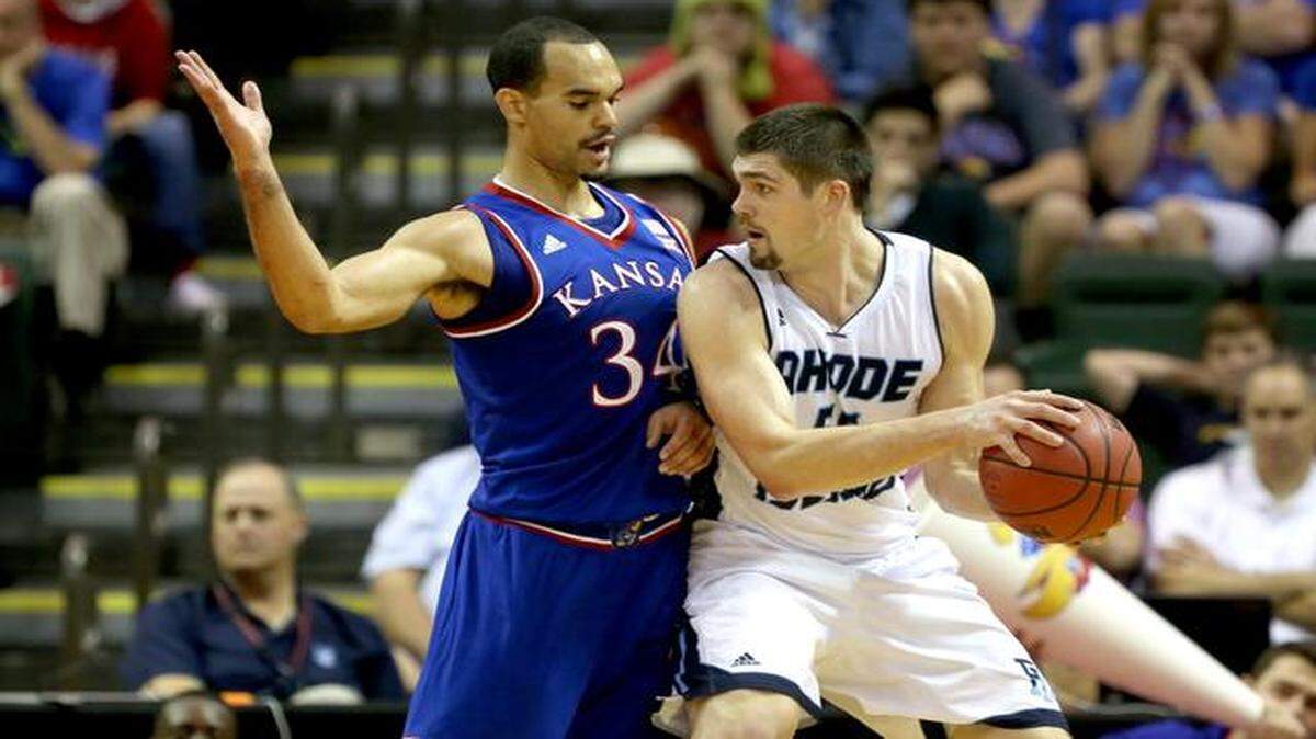 
Kansas forward Perry Ellis (34) defended against Rhode Island forward Gilvydas Biruta in the first half in the Orlando Classic on Thursday in Lake Buena Vista, Fla.
