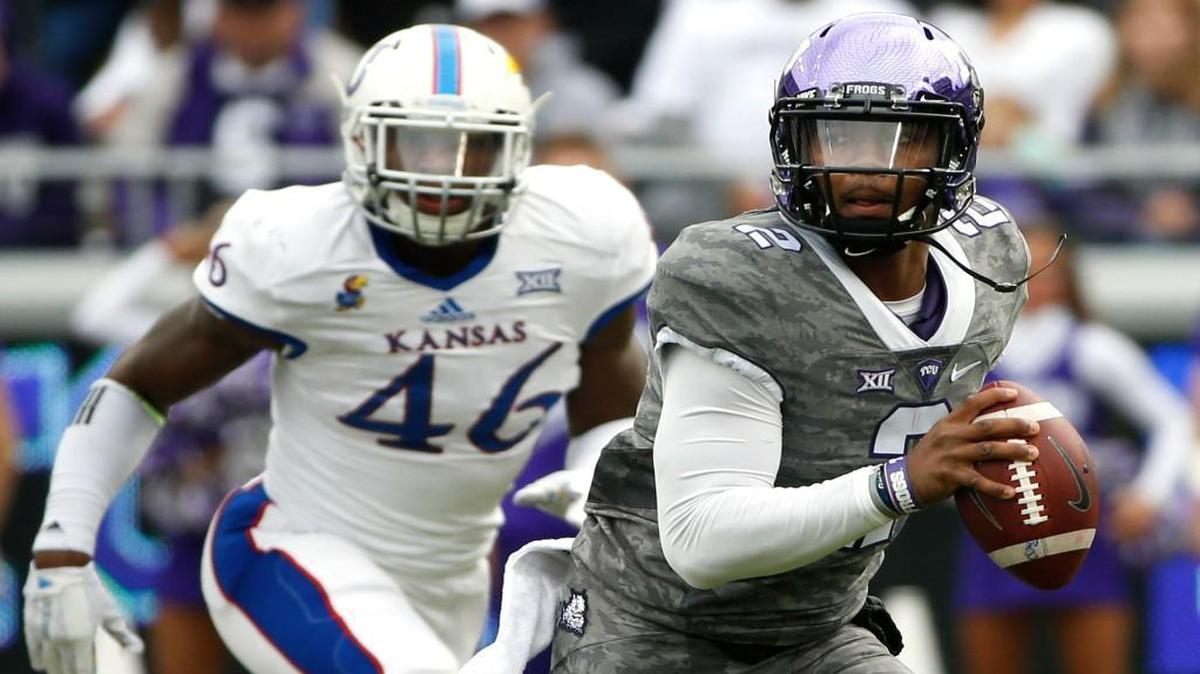 TCU quarterback Trevone Boykin ran from KU defensive end Dorance Armstrong Jr. in the first quarter of Saturday’s football game in Fort Worth, Texas. Boykin didn’t play the second half.