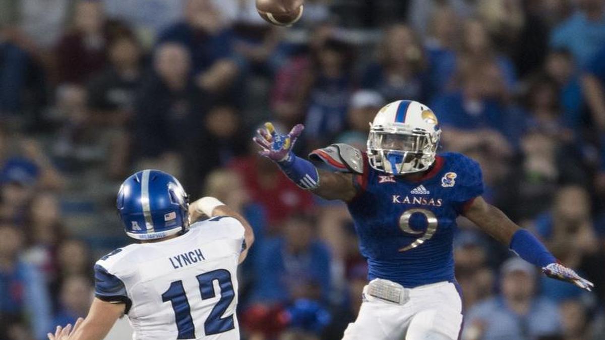 Memphis Tigers quarterback Paxton Lynch threw a pass over Kansas Jayhawks safety Fish Smithson during a game last fall.