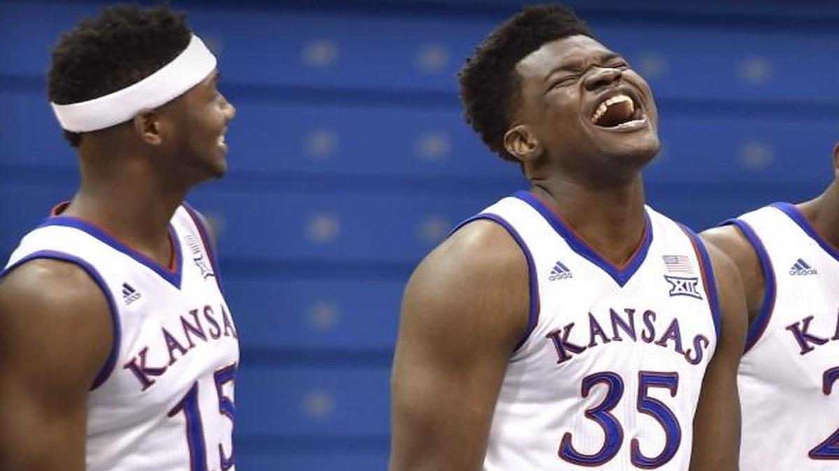 University of Kansas freshman Udoka Azubuike (shown laughing) will be among the newcomers making their KU debut Tuesday at Allen Fieldhouse. In October, he shared a laugh with sophomore Carlton Bragg (left) as the team photo was taken.