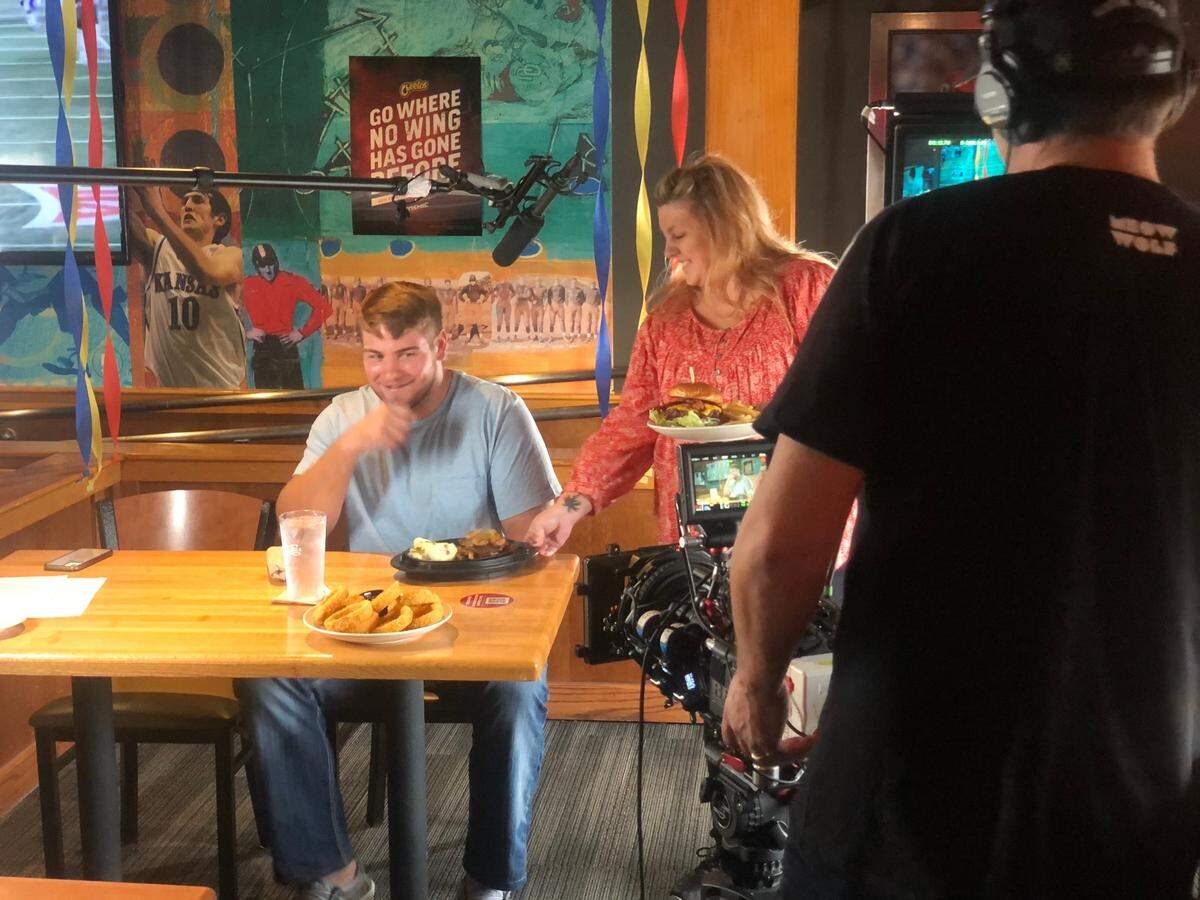 Kansas walk-on tight end Jared Casey, who caught the Jayhawks’ game-winning two-point conversion against Texas, films an Applebee’s commercial at the location on 25th and Iowa streets in Lawrence on Tuesday, Nov. 16, 2021.