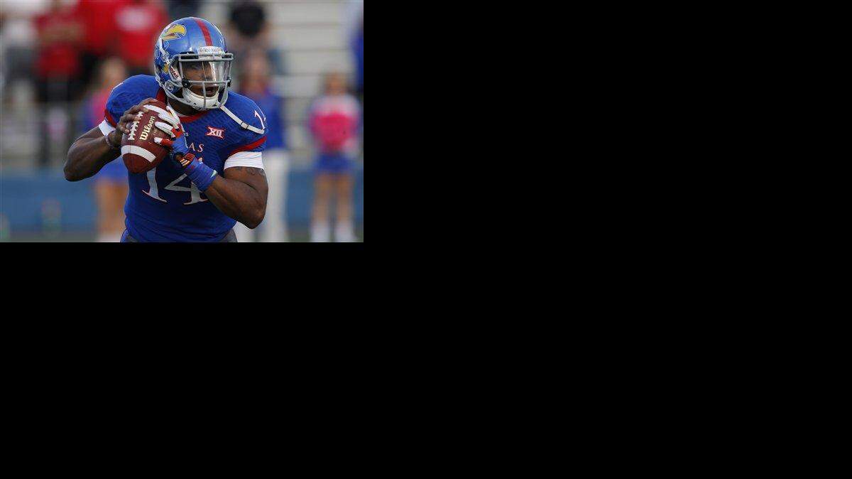 
Kansas quarterback Michael Cummings surveyed the field on a second-half pass play against Oklahoma State in Lawrence on Oct. 11. 
