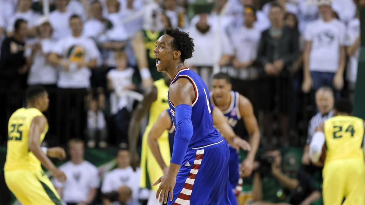 Kansas guard Devonte' Graham (4) celebrates after sinking a 3-point basket late in the second half of an NCAA college basketball game against Baylor on Tuesday, Feb. 23, 2016, in Waco, Texas. Kansas won 66-60. (AP Photo/Tony Gutierrez)