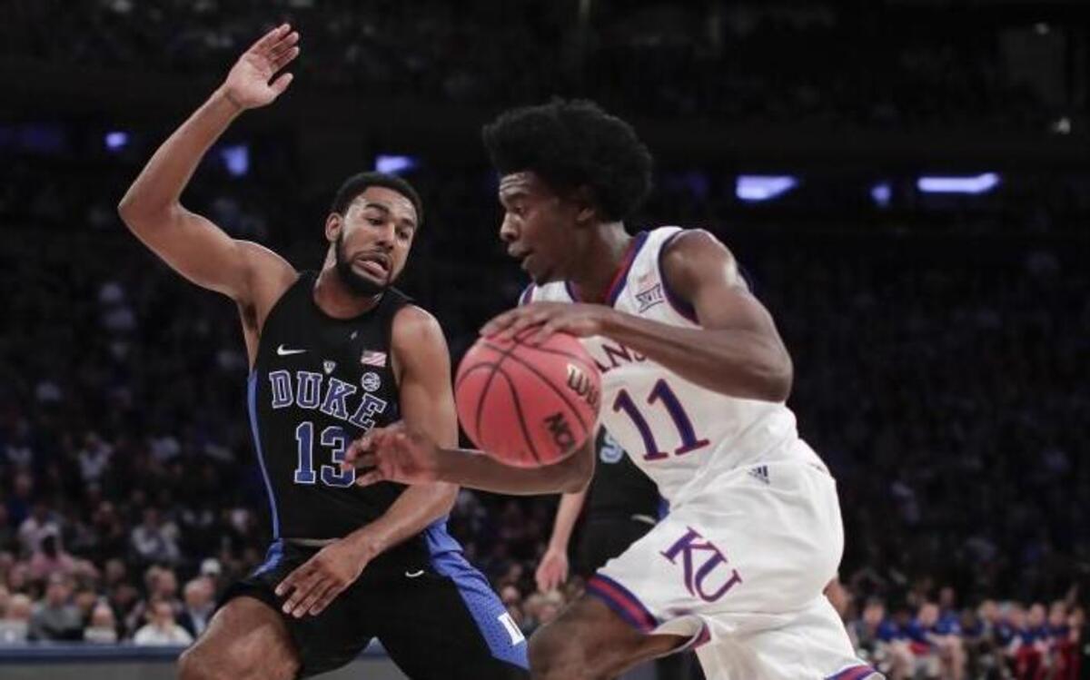 Kansas guard Josh Jackson tried to drive past Duke guard Matt Jones during Tuesday’s game.