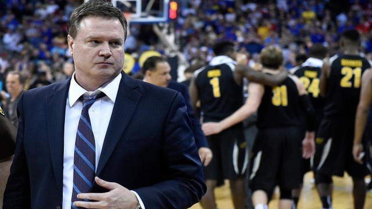 
Kansas coach Bill Self made his way off the court as Wichita State players celebrated their 78-65 NCAA Tournament win over the Jayhawks on Sunday in Omaha, Neb.
