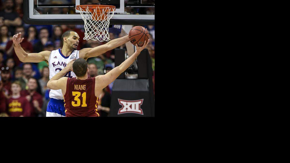 
Kansas Jayhawks forward Perry Ellis (34) defended a second half shot by Iowa State Cyclones forward Georges Niang (31) in game action Saturday evening, March 14, 2015 at the Big 12 Men's Basketball Championship Tournament at Sprint Center in Kansas City, Mo. Iowa State won, 70-66, to win the Big 12 Championship.
