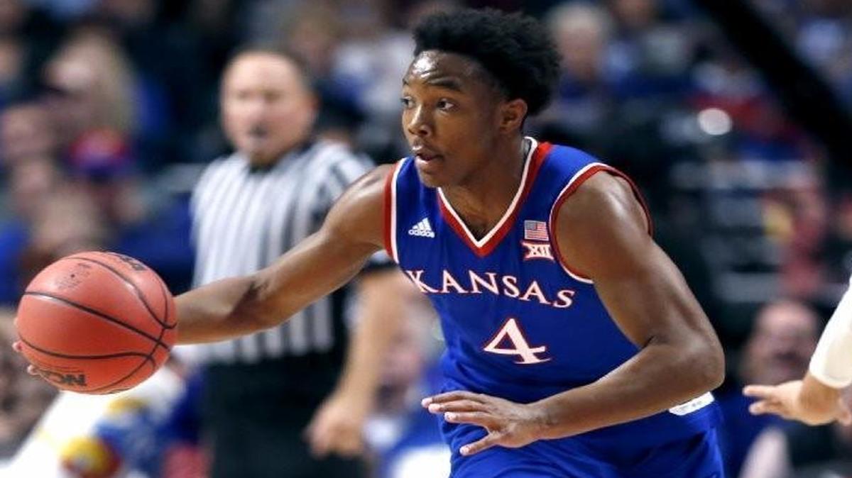 Devonte Graham (left) didn’t shoot well against Michigan State, but coach Bill Self said Graham graded out as the Jayhawks’ top guard against the Spartans.