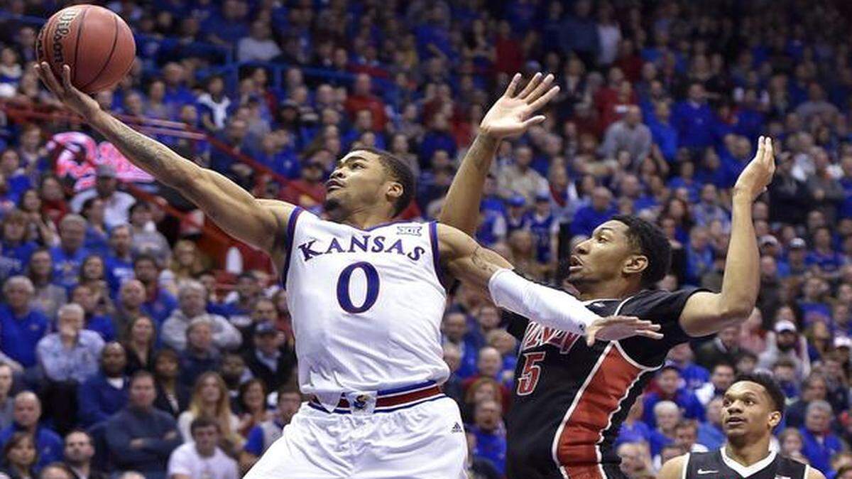 
KU’s Frank Mason drove past UNLV’s Christian Wood for a bucket during a game earlier this month.

