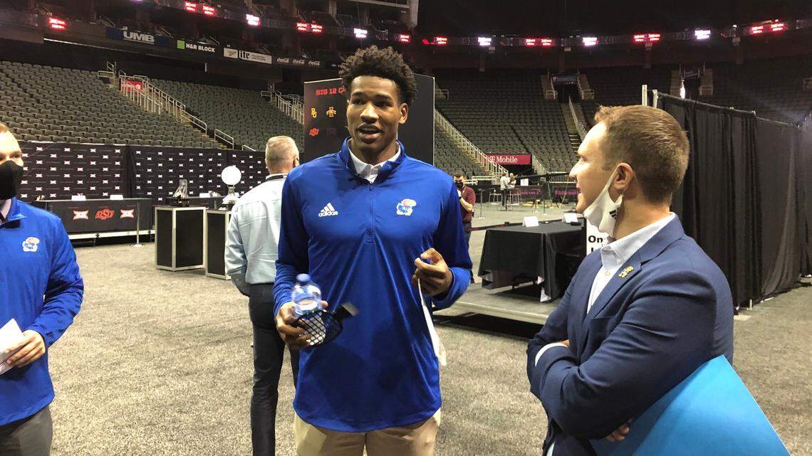 Kansas athletic director Travis Goff, right, speaks with KU men’s basketball player Ochai Agbaji at Big 12 men’s basketball media days on Wednesday, Oct. 20, 2021.