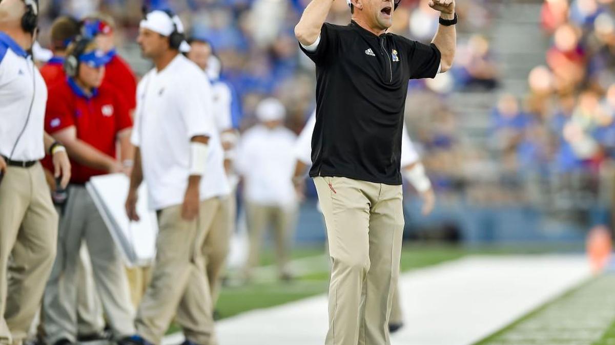 KU coach David Beaty, here on the sideline during Saturday’s game against Rhode Island, lauded the effort and talent of freshman offensive lineman Hakeem Adeniji.