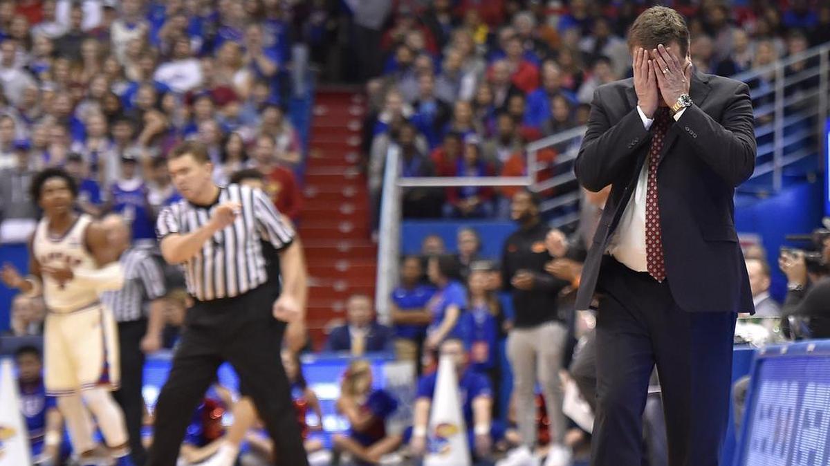 Kansas coach Bill Self had seen enough as Oklahoma State delivered another blow to his Jayhawks late in Saturday's game at Allen Fieldhouse. KU guard Devonte' Graham (left) disputed an official's call late in the game. OSU beat KU 84-79.