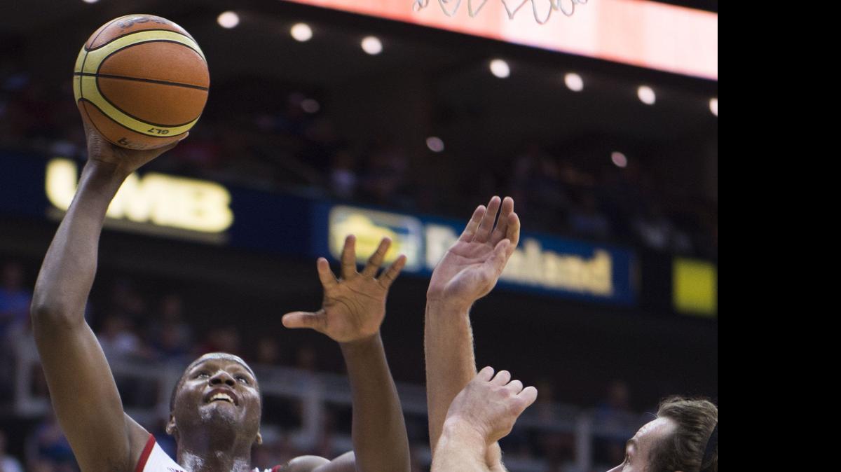 
University of Kansas forward Carlton Bragg Jr. shoots over Team Canada forward Chris McLaughlin during the Jayhawks and Team Canada basketball game at Sprint Center Friday, June 26
