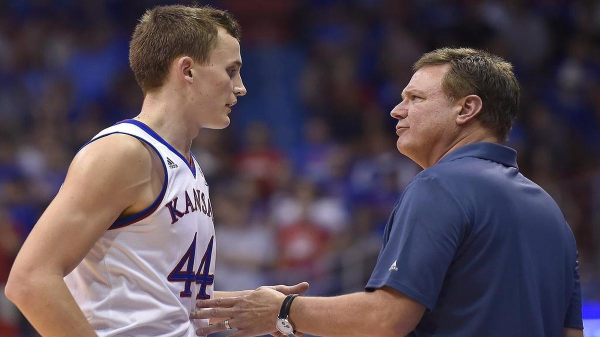 Mitch Lightfoot (left) is hoping to work his way deeper into Kansas coach Bill Self’s rotation next season for the Jayhawks. Lightfoot will be a senior next season.