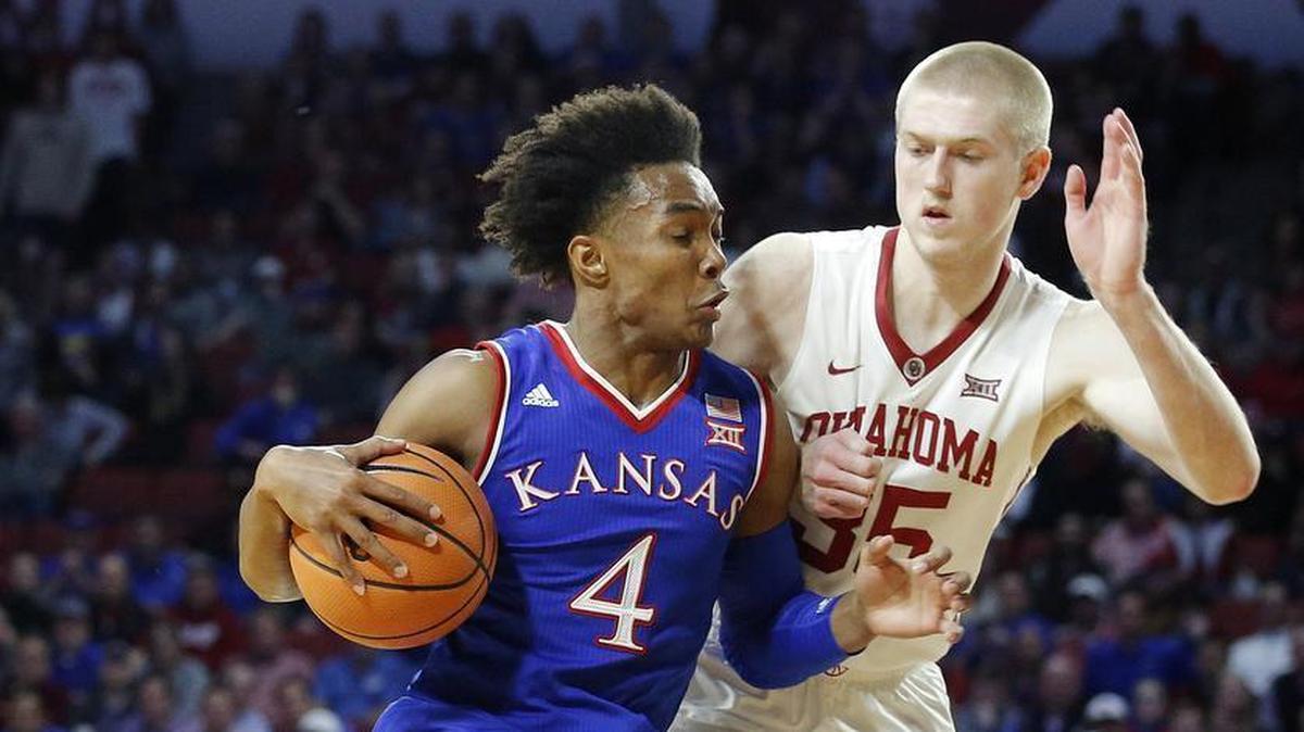 KU’s Devonte' Graham (left) played 40 minutes in Tuesday’s game against Oklahoma, which ended up winning when Brady Manek (right) hit a three-pointer with 26 seconds left that effectively ended the contest.