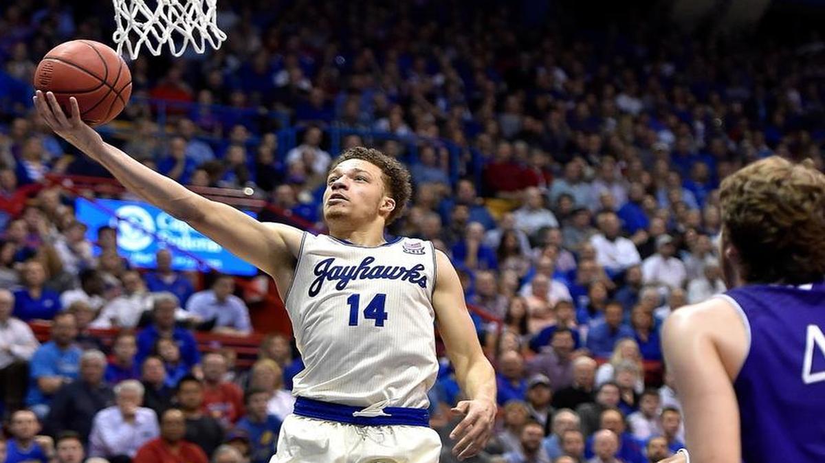 Kansas’ Brannen Greene came back from a six-game suspension to score 14 points on 5-6 shooting as the No. 2 Jayhawks beat Holy Cross 92-59 on Wednesday night at Allen Fieldhouse in Lawrence.
