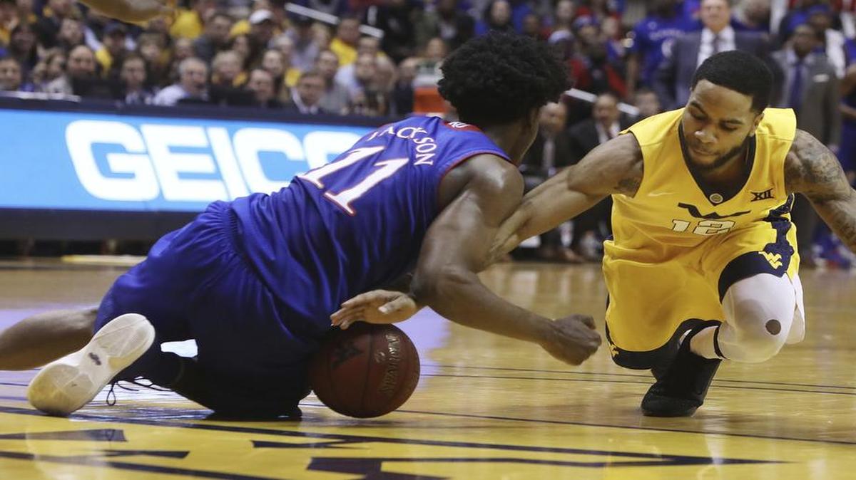 The Kansas Jayhawks and Josh Jackson (left) lost in their first meeting against West Virginia this season.