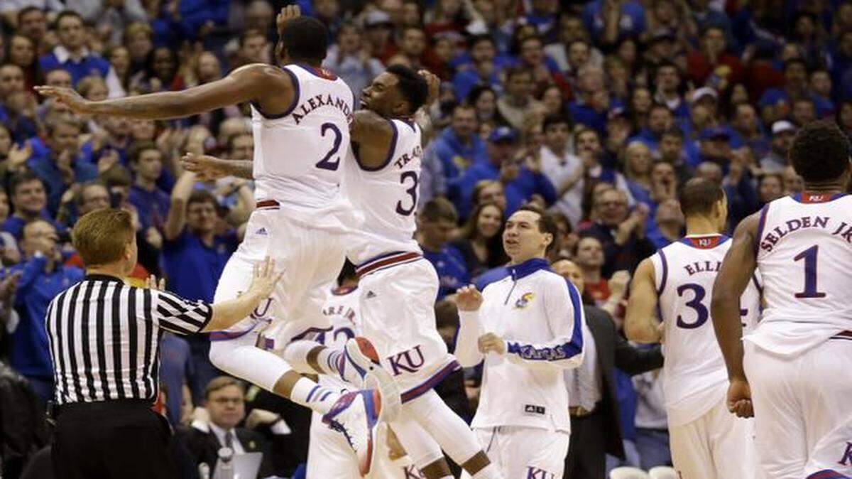 
Kansas forwards Cliff Alexander (left) and Jamari Traylor celebrated during a timeout in the second half against UNLV on Sunday. The Jayhawks defeated UNLV 76-61.
