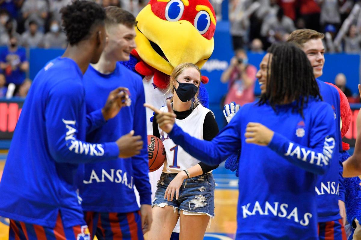 Libby Frost, a sophomore from WaKeeney, Kansas, was all smiles after she won $5,000 for sinking a 3-point shot during Late Night in the Phog Friday night at Allen Fieldhouse. The funds came out of the pocket of coach Bill Self.