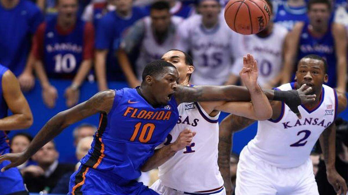 
Flordia's Dorian Finney-Smith (10) battled KU's Perry Ellis for a rebound during the first half of Friday night's game at Allen Fieldhouse.
