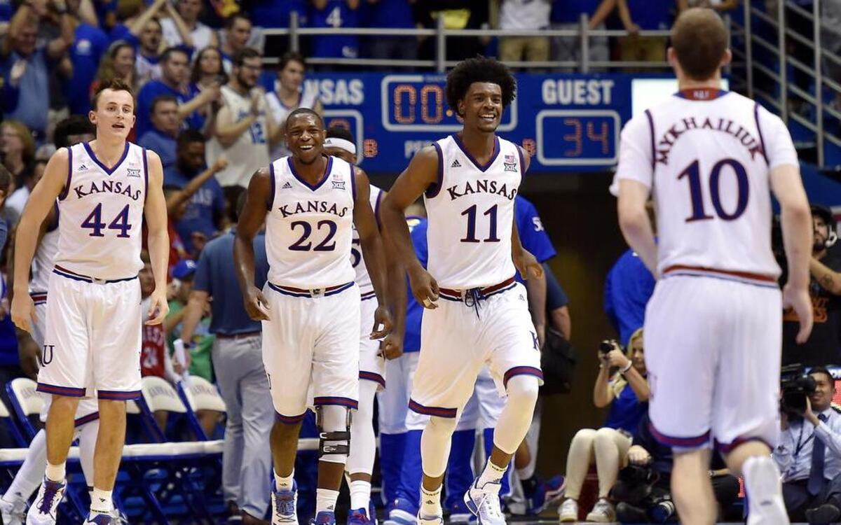 Kanas players celebrated together during a game earlier this season at Allen Fieldhouse.