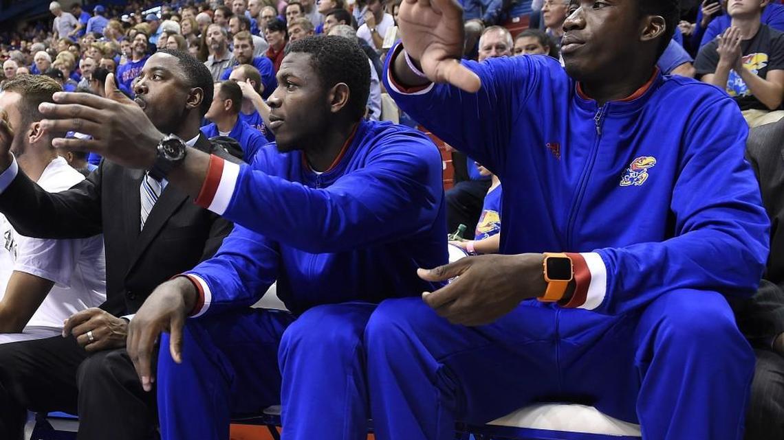 Cheick Diallo (right) can sit on KU’s bench but still isn’t eligible to play in a game.