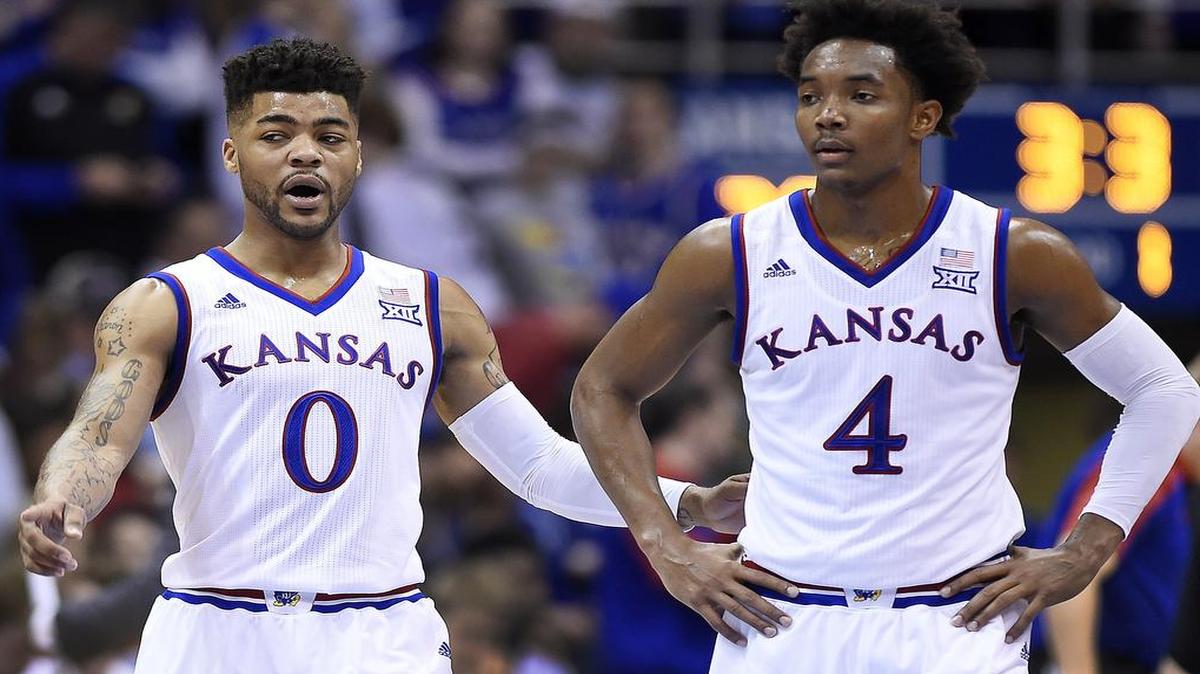KU's Frank Mason and Devonte' Graham talk during a break in the action of the first half of Saturday's game at Allen Fieldhouse. KU beat Texas 79-67.