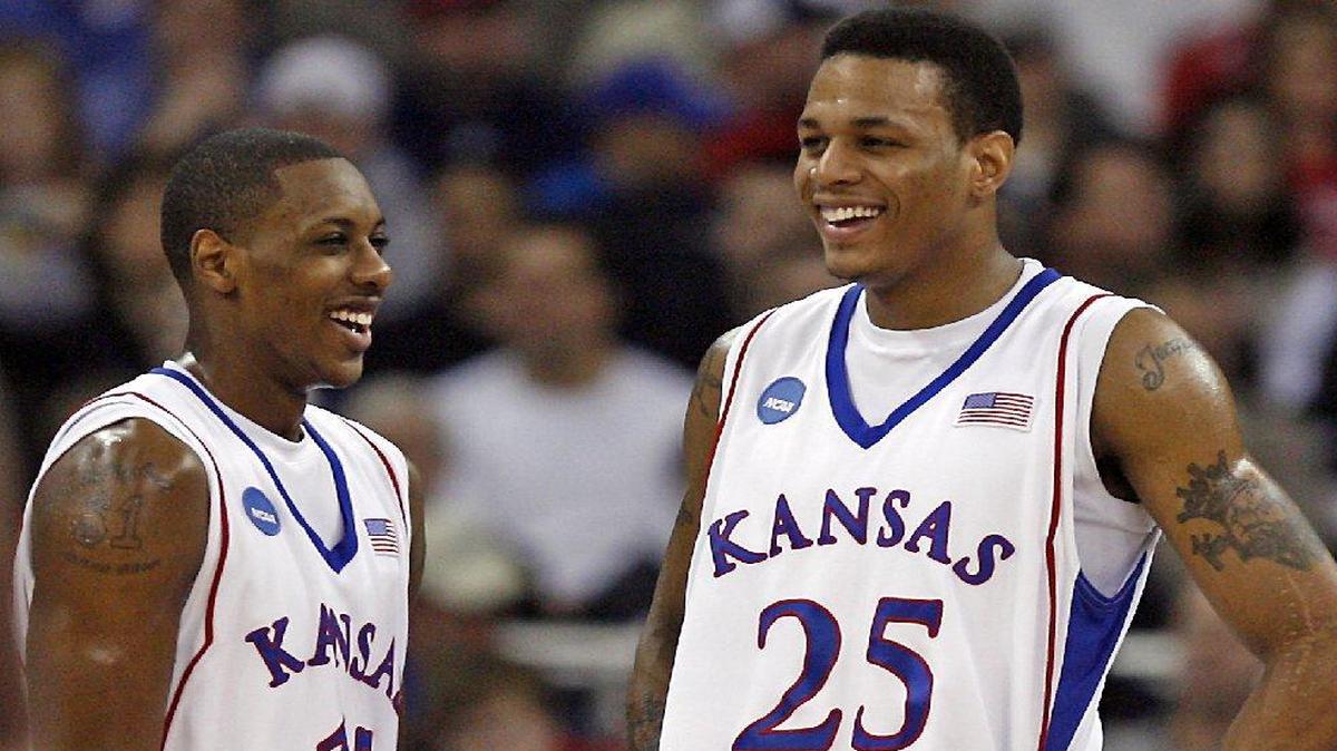 Brandon Rush (right) will have his jersey retired on Feb. 22, joining teammate Mario Chalmers (left), who received the honor in 2013.