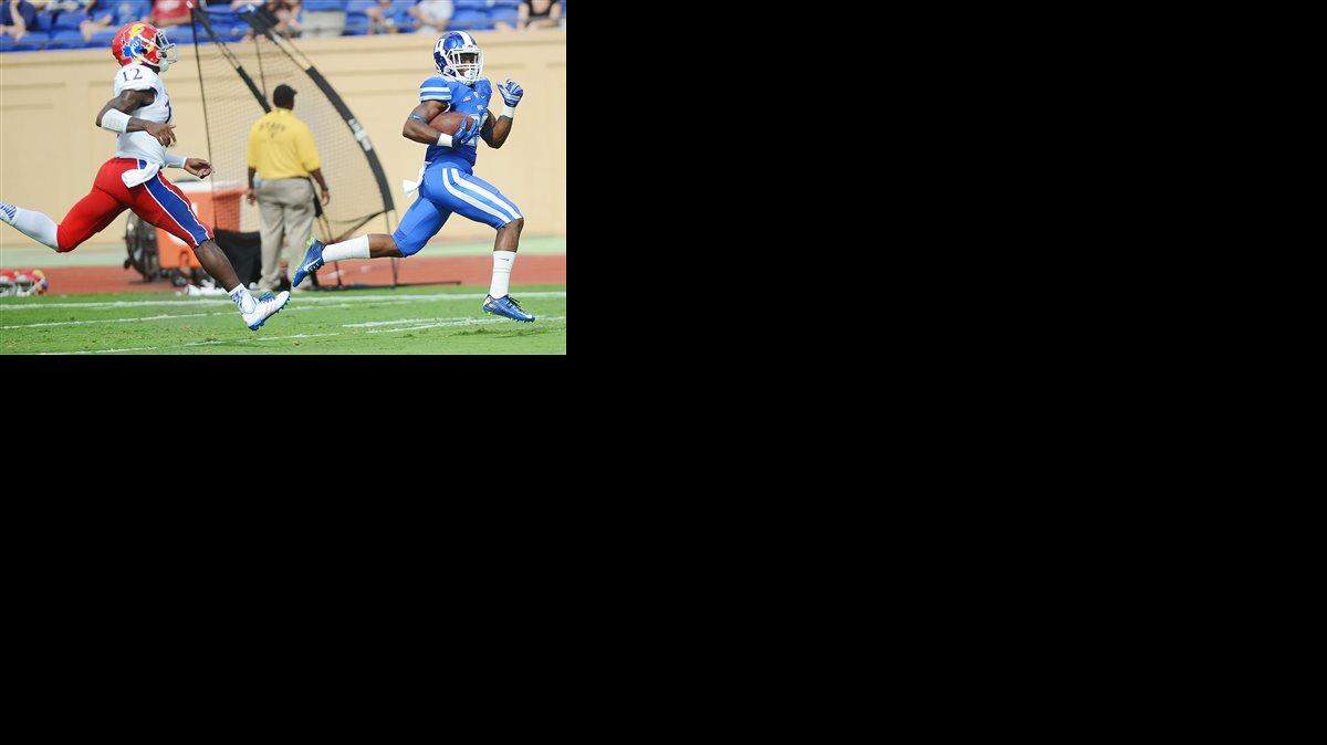 
Duke's Shaun Wilson scored a touchdown against Kansas' Darious Crawley in the first half of Saturday’s game.
