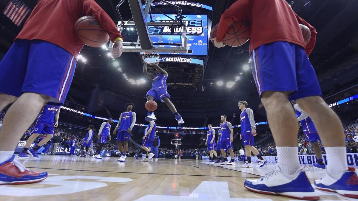 KU’s Dwight Coleby dunked during the Jayhawks’ pracitce Wednesday afternoon at the Sprint Center, where KU will play Purdue on Thursday night in the NCAA Tournament Midwest Regional semifinals.