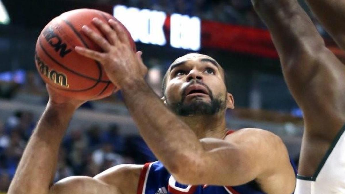 Forward Perry Ellis (left) scored 21 points in Kansas’ loss to Michigan State on Tuesday.