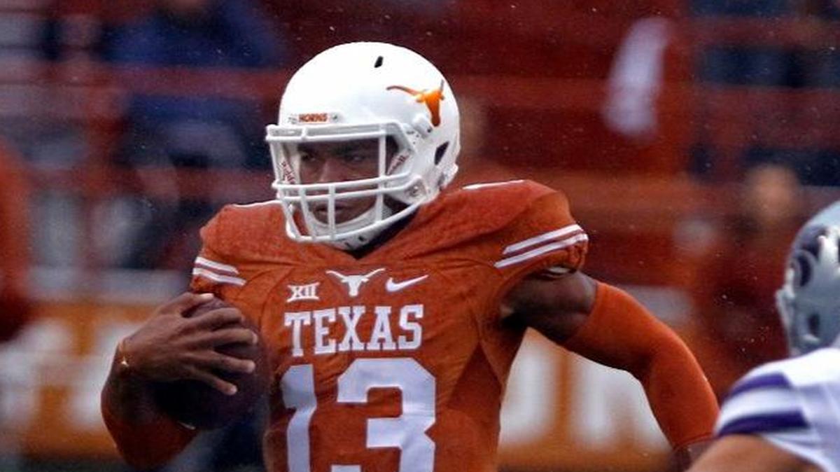 Jerrod Heard (left) has taken over as Texas’ starting quarterback.