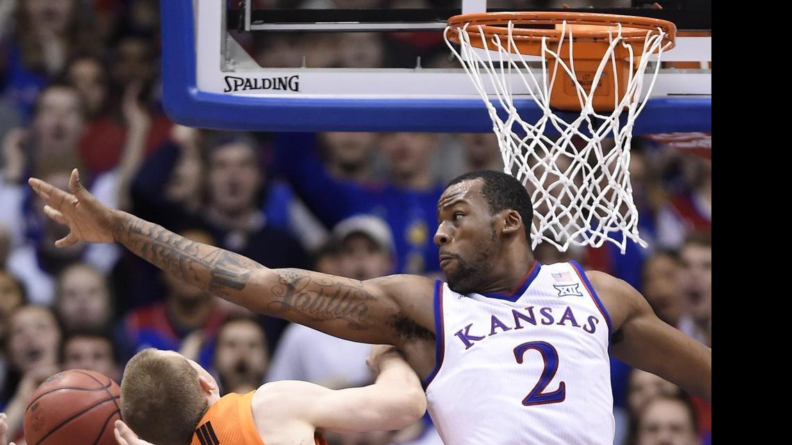 
KU’s Cliff Alexander went high to get a piece of a shot by Oklahoma State’s Phil Forte on Jan. 13 at Allen Fieldhouse in Lawrence, Kan. KU won 67-57.
