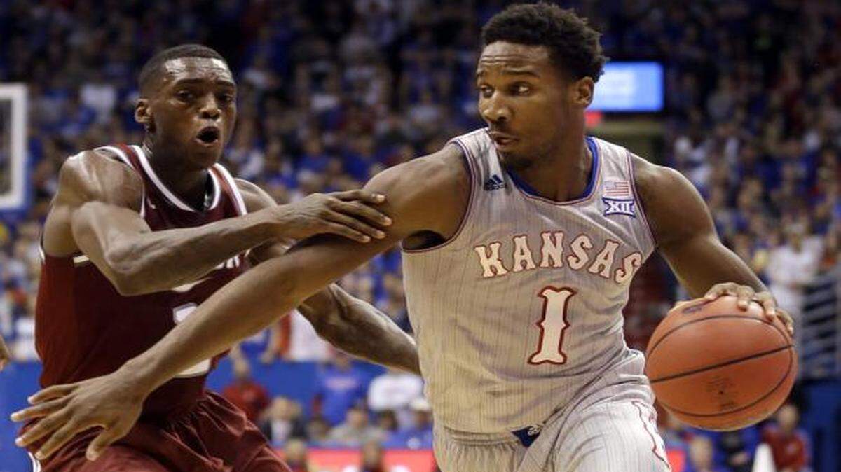 
Kansas guard Wayne Selden Jr. drove past Rider guard Zedric Sadler during the first half Monday in Lawrence.
