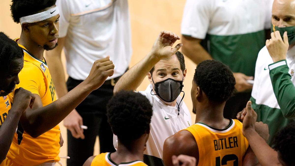 Baylor coach Scott Drew, center, and his team have had two Big 12 games postponed this season because of the coronavirus pandemic. Every Big 12 team has had at least one game postponed.