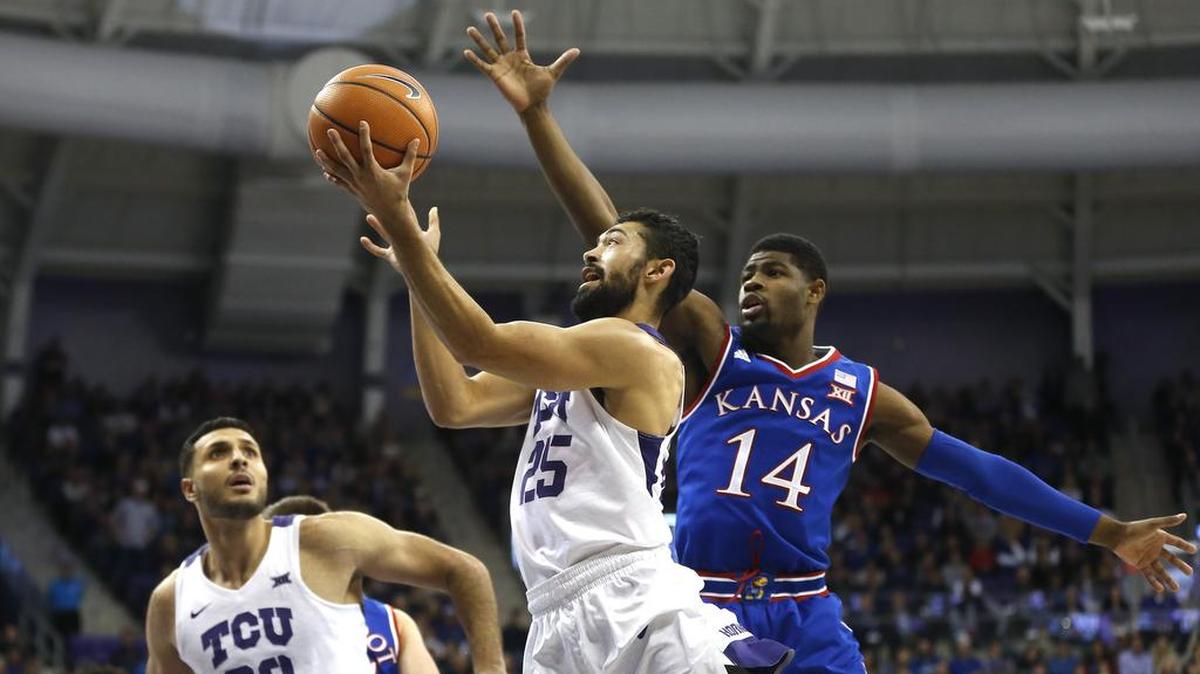 Kansas guard Malik Newman (right) is averaging 9.9 points per game this season, but he scored only one point in an 88-84 win over TCU on Saturday night.