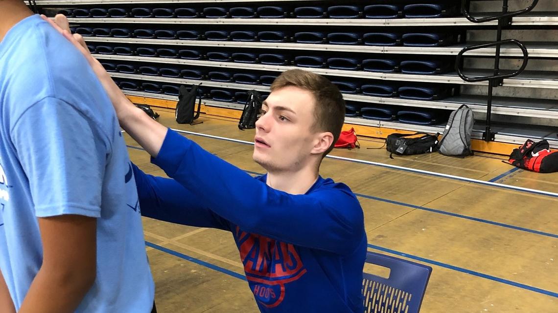 Kansas guard Christian Braun signs for a fan during Washburn basketball camp on Tuesday, June 15, 2021, in Topeka, Kansas.