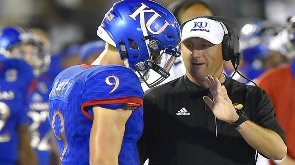 Kansas Jayhawks head coach David Beaty talked to Jayhawks quarterback Carter Stanley during a game in September.