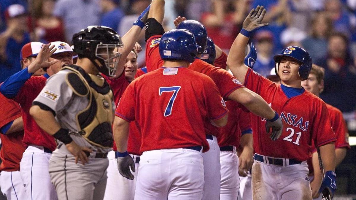 Kansas’ Preston Land was greeted by teammates after hitting a home run in the fifth inning of a game between the Jayhawks and Missouri at Kauffman Stadium in 2009. KU also played MU at Kauffman in 2011, but that was the last time the team came to the stadium — until this spring, when the Jayhawks will take on the Cornhuskers.