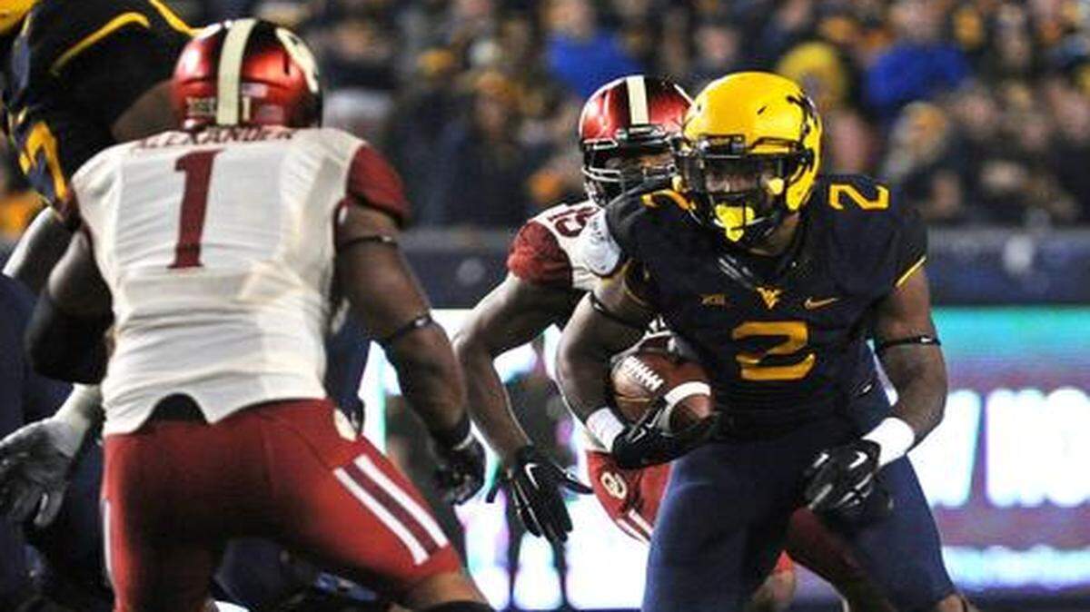 
West Virginia running back Dreamius Smith (right).

