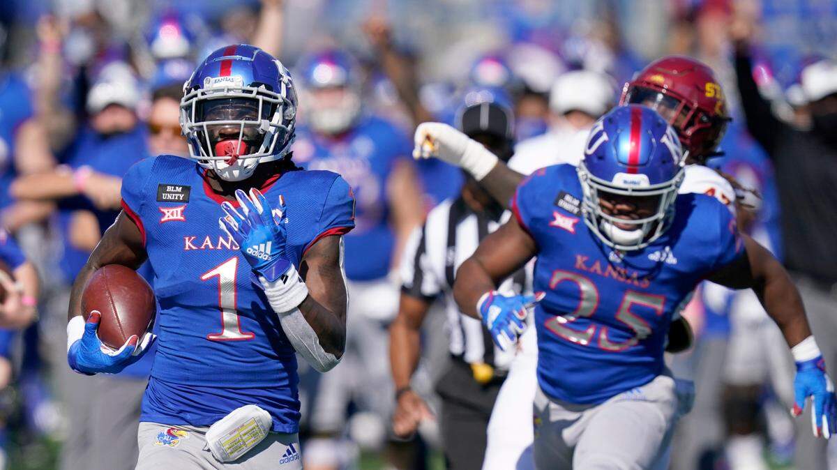Kansas return specialist Kenny Logan Jr. (1) returns a kickoff 100-yards for a touchdown during the second half of a college football game against Iowa State in Lawrence, Kan., Saturday, Oct. 31, 2020.