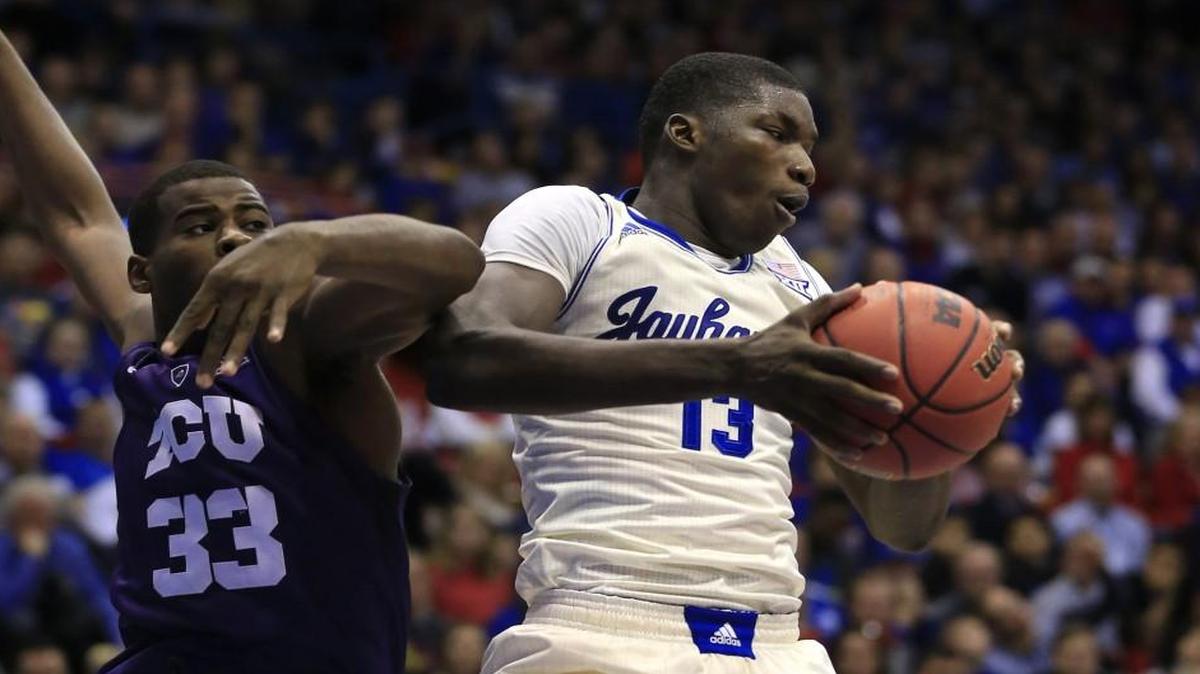 Kansas forward Cheick Diallo (right) grabbed rebound against TCU forward Chris Washburn during a game in Saturday.