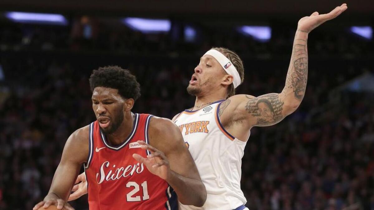 Former KU center Joel Embiid (left) came up with a big game for the Sixers against former K-State star Michael Beasley and the Knicks on Monday. Embiid had 25 points, 16 rebounds, three blocks and three assists in Philadelphia’s 105-98 victory