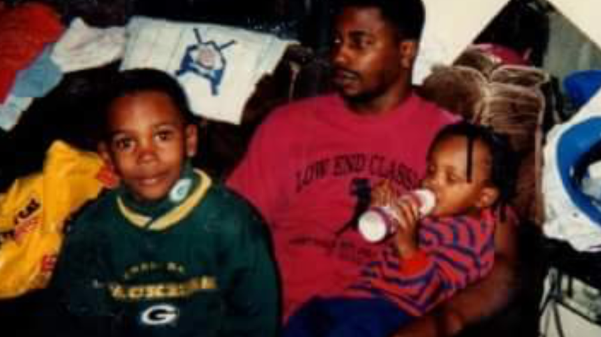 Jamari Traylor, left, shown at approximately 6 years old with his father, Jessie, and his brother, Jamani.