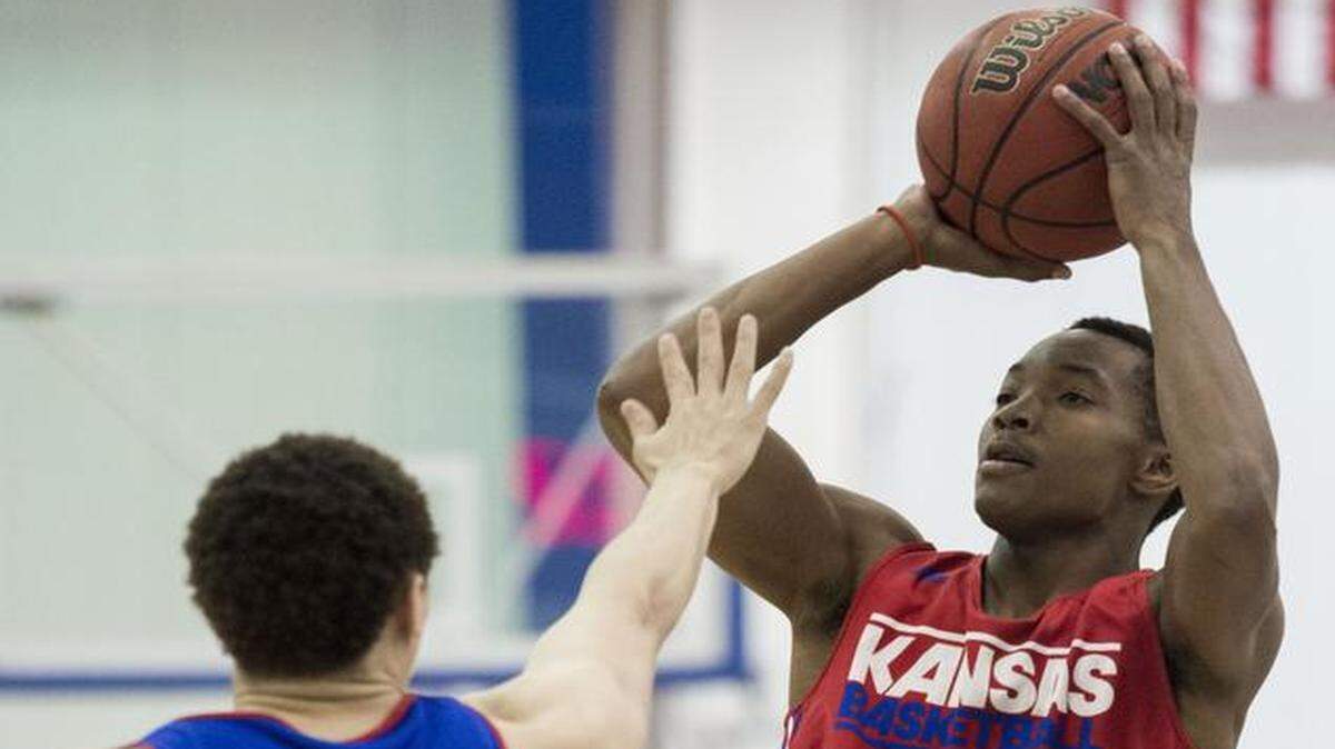 
Kansas guard Devonte’ Graham (right) launched a shot over Brannen Greene during the annual scrimmage held at the end of Bill Self’s camp in June.
